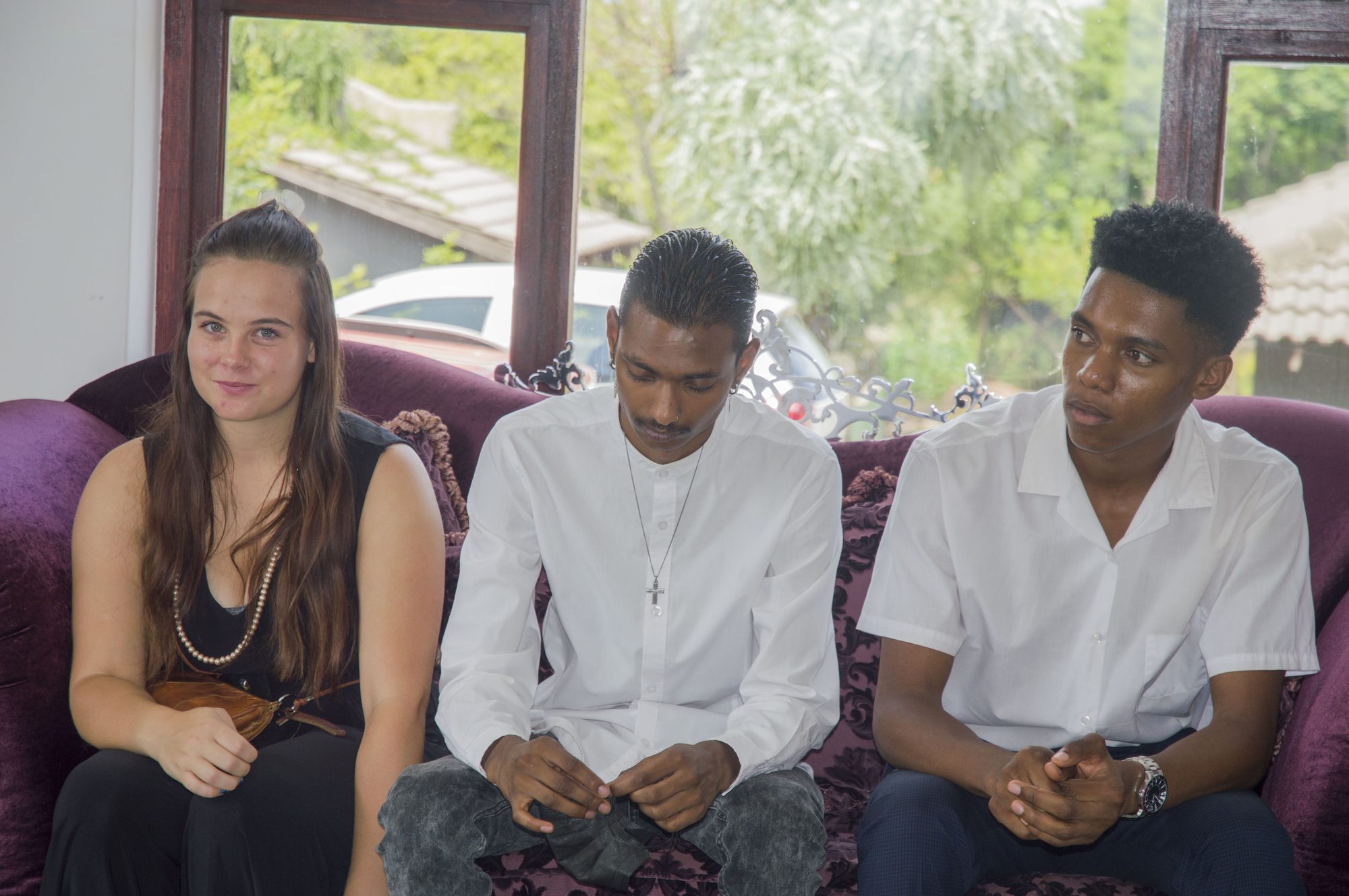 Three young participants seated in conversation